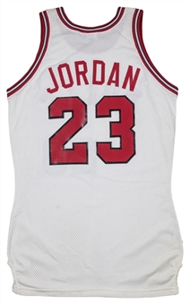 Michael Jordans First Ever Bulls Jersey! 1984 Chicago Bulls Jordan Jersey Photo Matched To Jordan Holding Jersey Following Signing First Contract With Bulls-9/12/84 (Sports Investors Authentication)